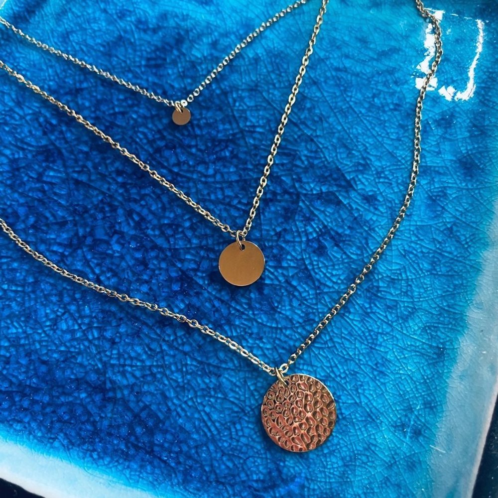 Trio of gold disc necklaces